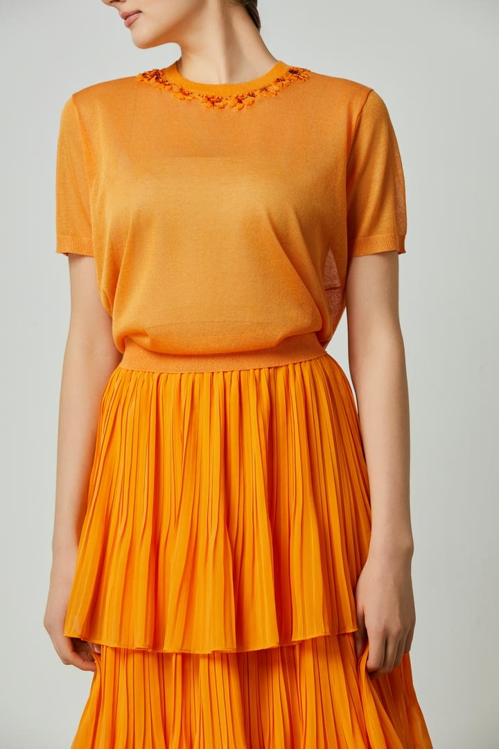 Orange embellished top